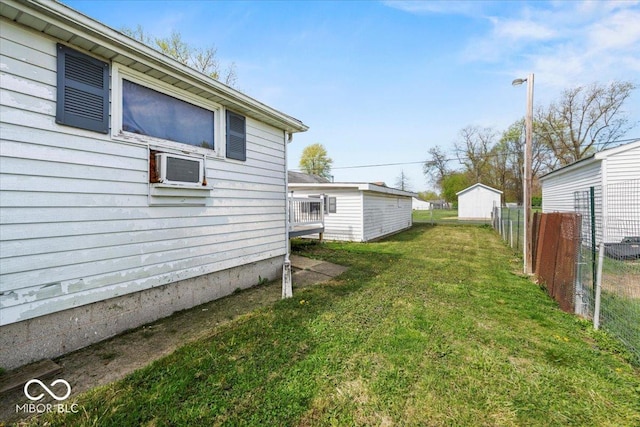 view of yard with a wall mounted AC and fence