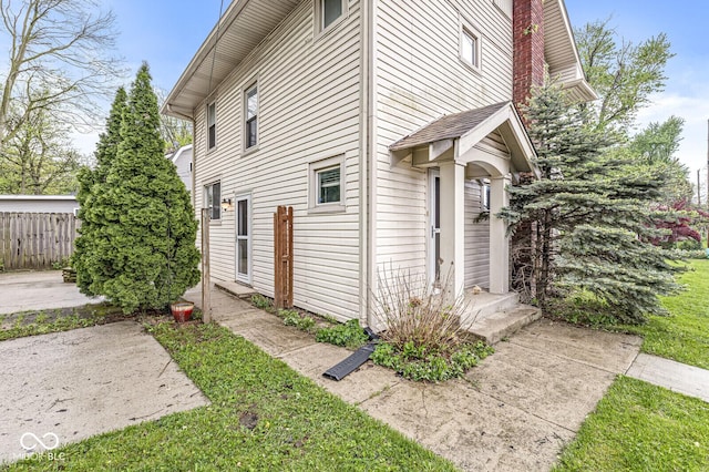 view of property exterior with fence