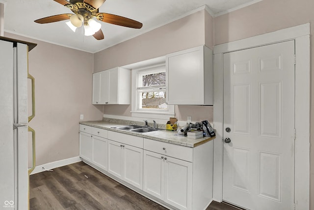734 N Bradley Ave, Indianapolis, IN 46201 - kitchen featuring light countertops, white cabinetry, ceiling fan, and a sink