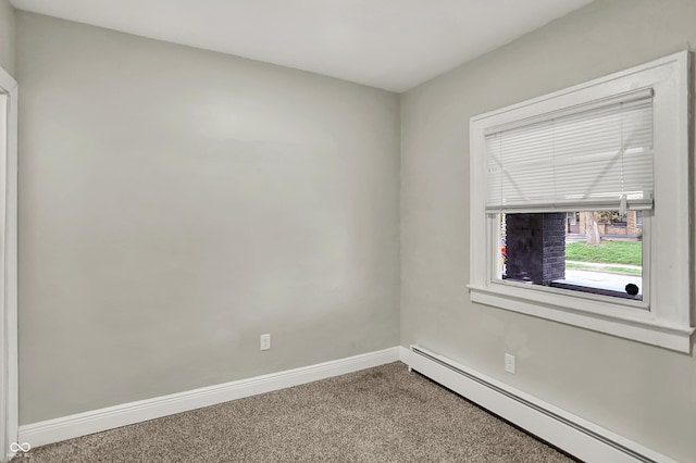 734 N Bradley Ave, Indianapolis, IN 46201 - carpeted spare room featuring baseboards and a baseboard radiator