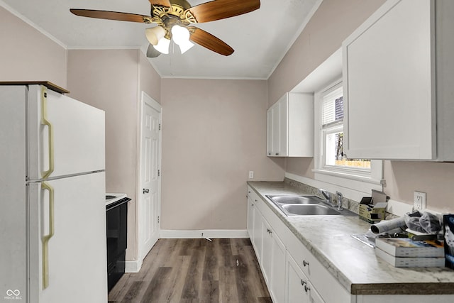 734 N Bradley Ave, Indianapolis, IN 46201 - kitchen with a sink, freestanding refrigerator, dark wood finished floors, electric range oven, and ornamental molding