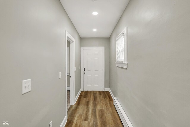 734 N Bradley Ave, Indianapolis, IN 46201 - corridor featuring recessed lighting, baseboards, baseboard heating, and wood finished floors