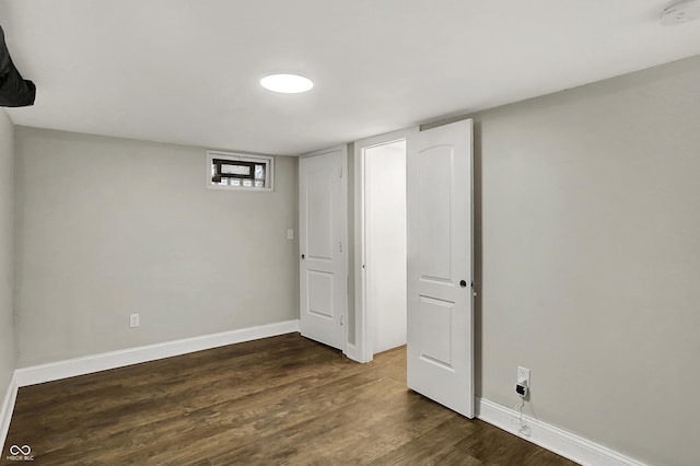 734 N Bradley Ave, Indianapolis, IN 46201 - below grade area featuring baseboards and dark wood-type flooring