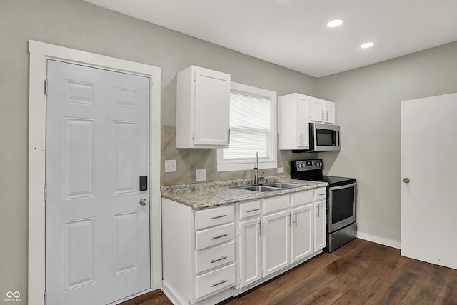 734 N Bradley Ave, Indianapolis, IN 46201 - kitchen featuring a sink, stainless steel appliances, white cabinetry, dark wood-type flooring, and recessed lighting