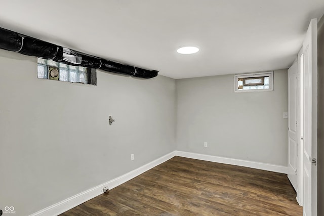 734 N Bradley Ave, Indianapolis, IN 46201 - basement with baseboards and dark wood-type flooring