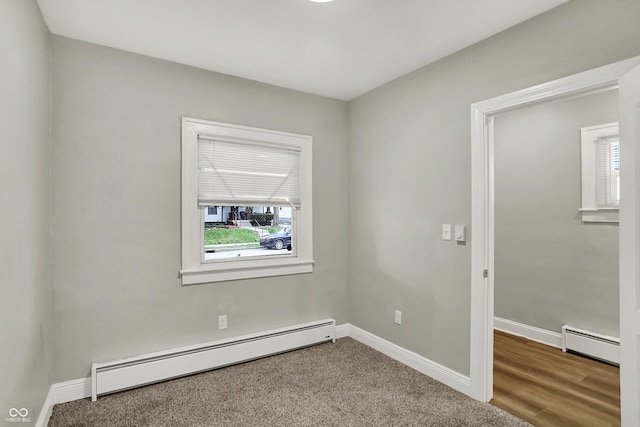 734 N Bradley Ave, Indianapolis, IN 46201 - spare room featuring baseboards and baseboard heating