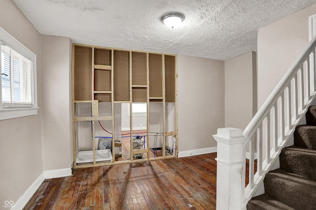 734 N Bradley Ave, Indianapolis, IN 46201 - interior space featuring baseboards, wood-type flooring, and a textured ceiling