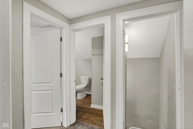 734 N Bradley Ave, Indianapolis, IN 46201 - bathroom with toilet, baseboards, and wood finished floors