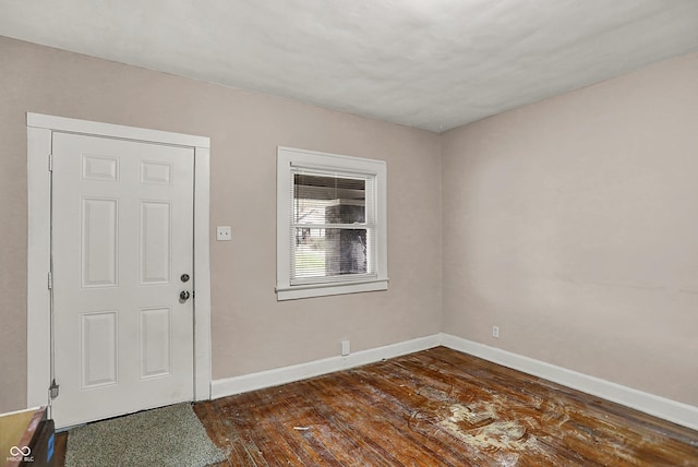 734 N Bradley Ave, Indianapolis, IN 46201 - entrance foyer with baseboards and dark wood-style floors