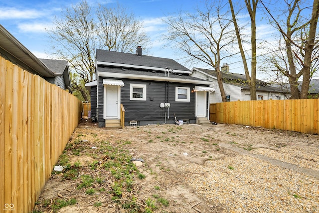 734 N Bradley Ave, Indianapolis, IN 46201 - rear view of property with a shingled roof, entry steps, and a fenced backyard