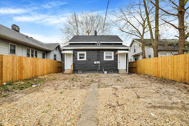 734 N Bradley Ave, Indianapolis, IN 46201 - rear view of property with a fenced backyard and entry steps