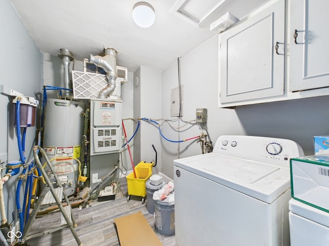 clothes washing area with water heater, independent washer and dryer, light wood-type flooring, electric panel, and cabinet space