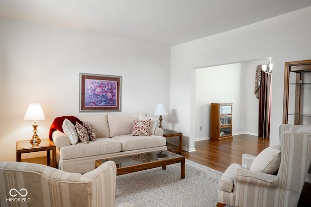 living area with wood finished floors and baseboards