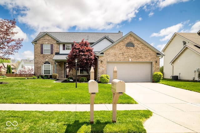 traditional home with concrete driveway, a front yard, central AC, brick siding, and a garage