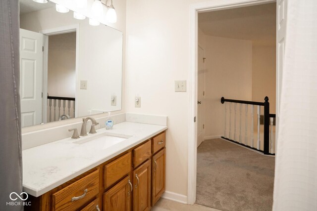 bathroom featuring vanity and baseboards