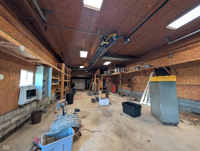 interior space with heating unit and a garage