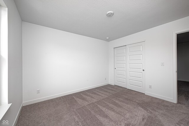 7265 Governors Row, Avon, IN 46123 - unfurnished bedroom featuring a closet, carpet floors, and baseboards
