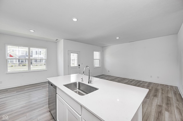 7265 Governors Row, Avon, IN 46123 - kitchen with light wood finished floors, a sink, light countertops, baseboards, and dishwasher