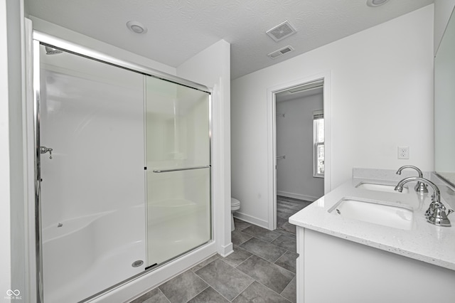 7265 Governors Row, Avon, IN 46123 - bathroom featuring a sink, a stall shower, toilet, and visible vents