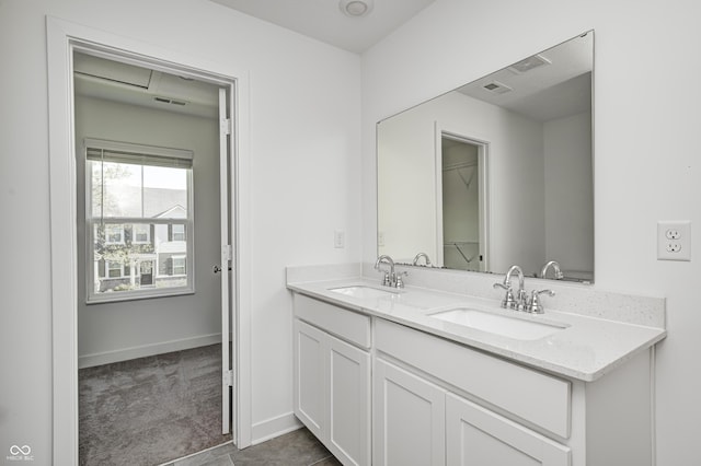 7265 Governors Row, Avon, IN 46123 - bathroom with double vanity, visible vents, baseboards, and a sink