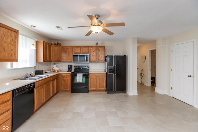 kitchen with brown cabinetry, a ceiling fan, light countertops, a sink, and black appliances