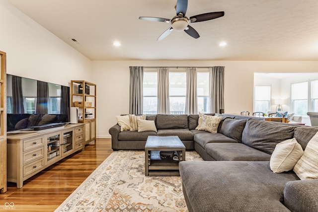 living area featuring recessed lighting, wood finished floors, and a ceiling fan