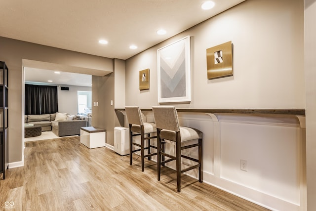 interior space with light wood finished floors, recessed lighting, and baseboards