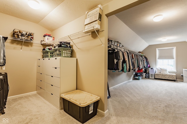 spacious closet featuring carpet and lofted ceiling
