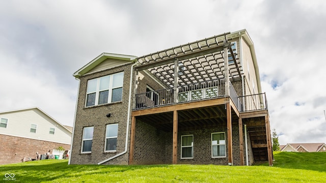 back of property featuring a lawn, a wooden deck, and brick siding