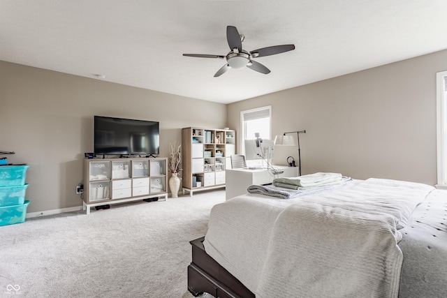 carpeted bedroom with a ceiling fan