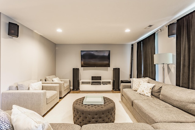 living room featuring visible vents and recessed lighting