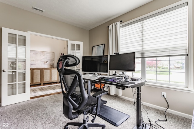 office area with visible vents, french doors, carpet flooring, and baseboards