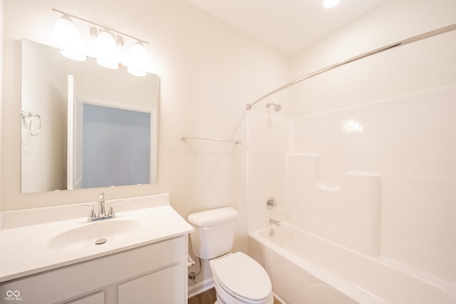 bathroom featuring toilet, shower / bath combination, and vanity