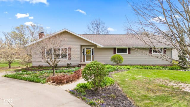 1301 N Maple St, Veedersburg, IN 47987 - ranch-style house with a shingled roof, a chimney, and a front yard