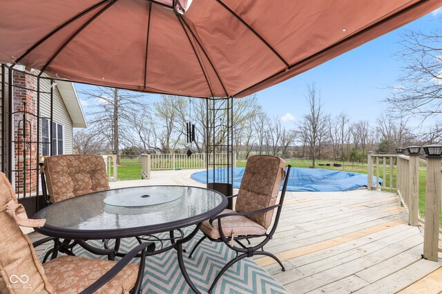 1301 N Maple St, Veedersburg, IN 47987 - wooden deck featuring a fenced in pool and outdoor dining area