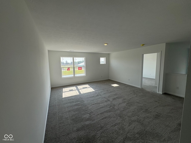 210 Aster Way, Greenfield, IN 46140 - spare room featuring carpet flooring and baseboards