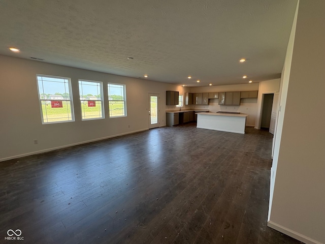 210 Aster Way, Greenfield, IN 46140 - unfurnished living room with recessed lighting and dark wood-type flooring