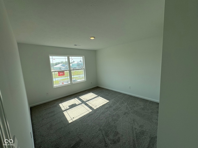 210 Aster Way, Greenfield, IN 46140 - unfurnished room featuring dark colored carpet and baseboards