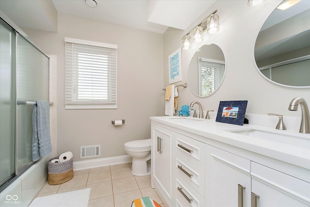 full bathroom with tile patterned flooring, visible vents, a sink, and toilet