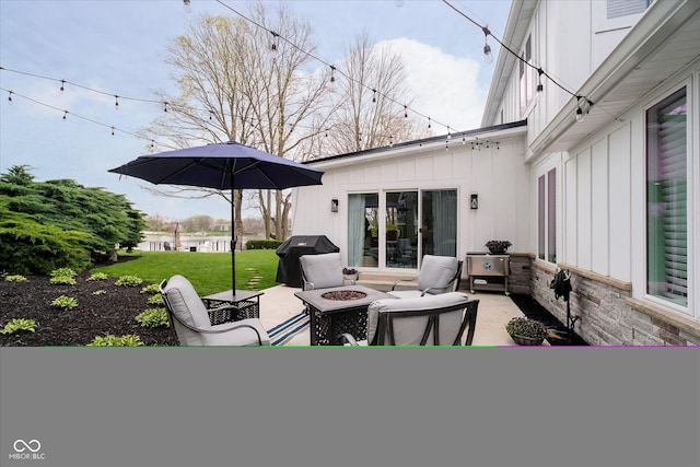 view of patio featuring a fire pit and a grill