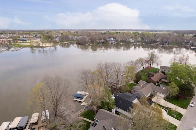 bird's eye view featuring a water view and a residential view