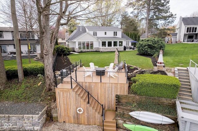 back of house with a wooden deck, stairway, a yard, and outdoor dining space