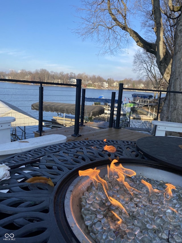 wooden terrace featuring a water view