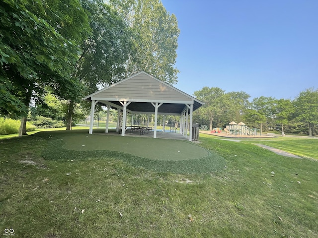 view of home's community featuring a gazebo, a yard, and playground community