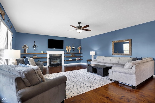 13836 Fieldcrest Dr, Mccordsville, IN 46055 - living room with hardwood / wood-style flooring, baseboards, a ceiling fan, and a tile fireplace