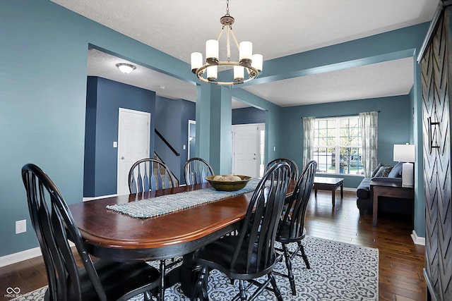 13836 Fieldcrest Dr, Mccordsville, IN 46055 - dining space featuring dark wood-type flooring, a chandelier, stairs, and baseboards