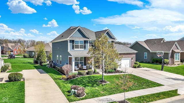 13836 Fieldcrest Dr, Mccordsville, IN 46055 - view of front of house featuring a front lawn, driveway, a porch, brick siding, and a garage