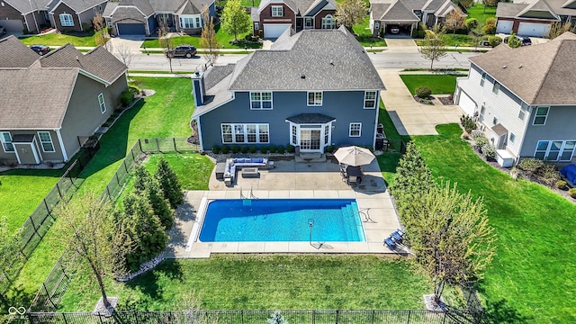 13836 Fieldcrest Dr, Mccordsville, IN 46055 - view of swimming pool with a fenced backyard, a residential view, a fenced in pool, and a lawn