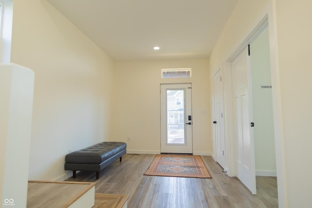 2302 Prospect St, Indianapolis, IN 46203 - foyer with baseboards, light wood-style floors, and recessed lighting