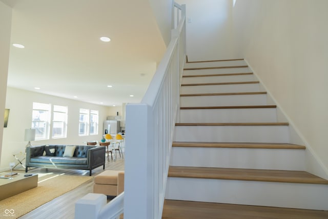 2302 Prospect St, Indianapolis, IN 46203 - stairs featuring recessed lighting and wood finished floors